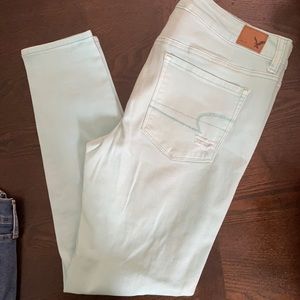 distressed mint colored skinnies